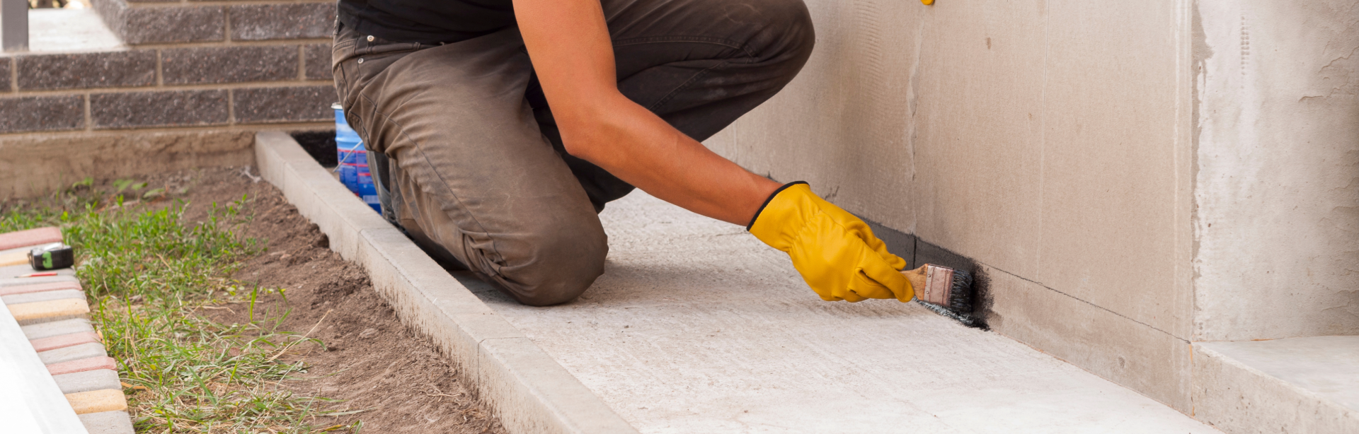 Basement waterproofing system installation in progress