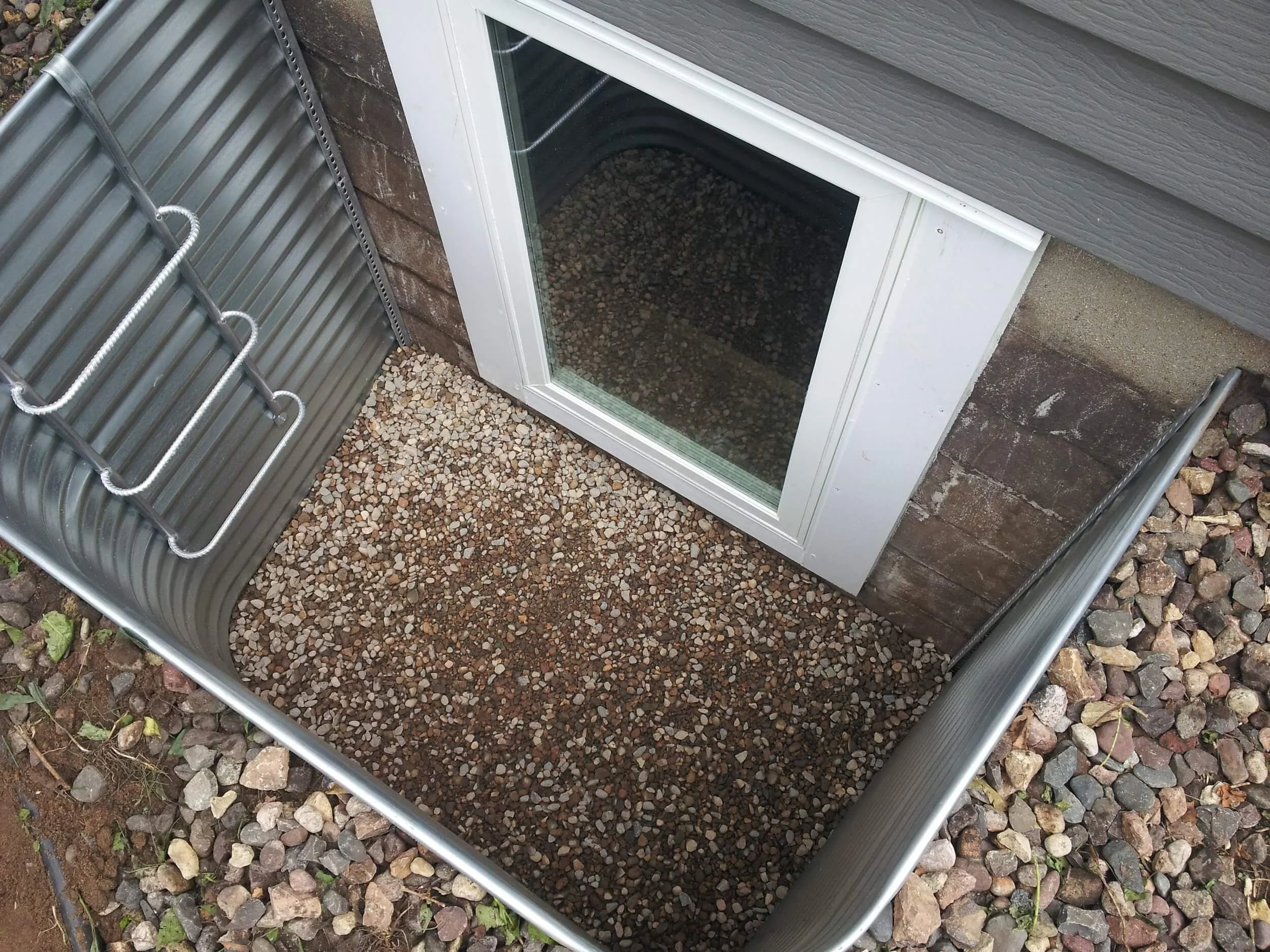 Basement window well and egress window installation