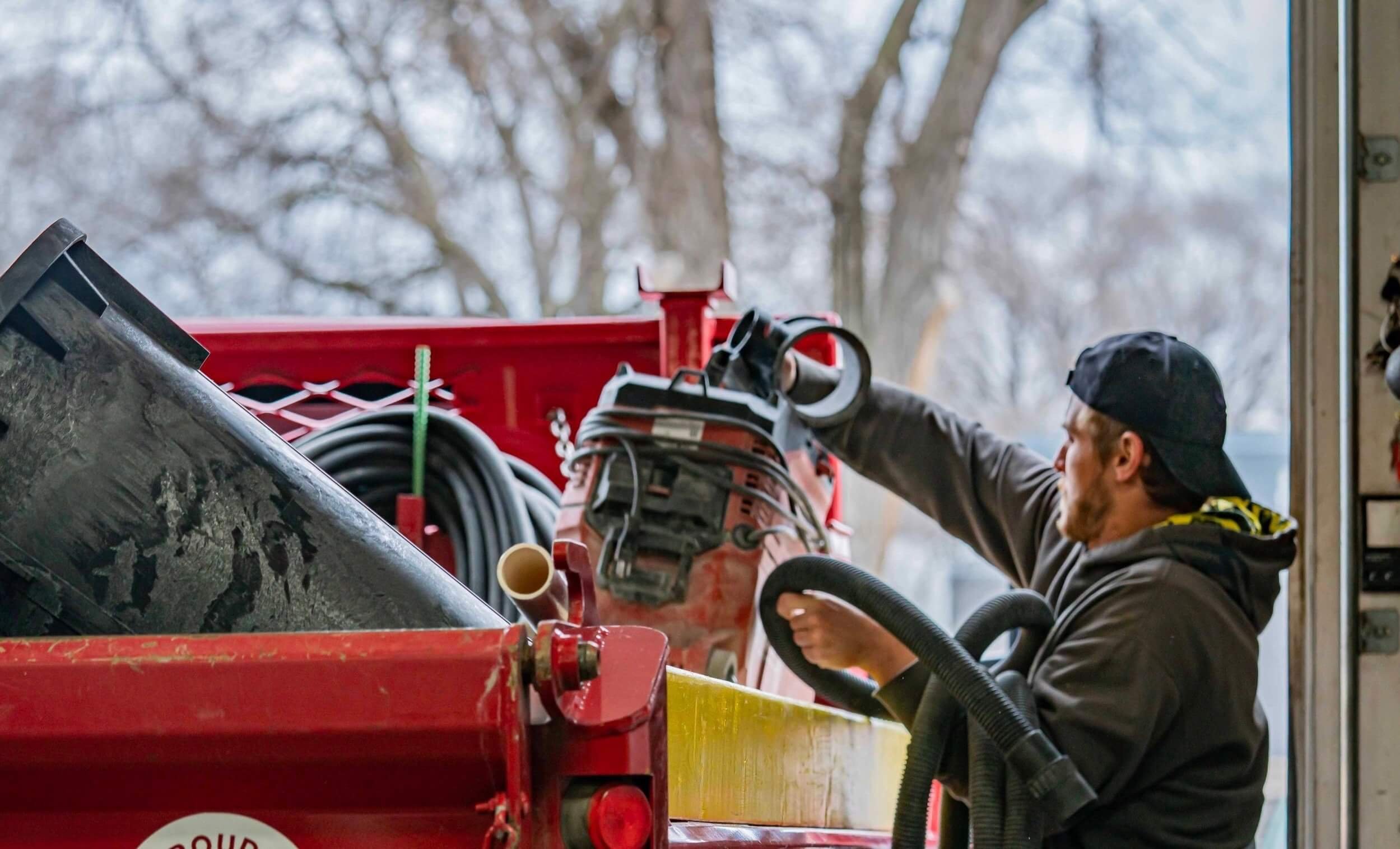 Gardner Construction estimator inspecting basement foundation cracks