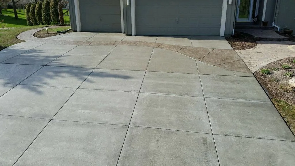 New concrete driveway installation by Gardner crew